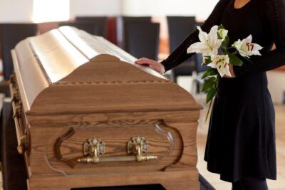 Wrongful Death Lawyer in Forest Park | No Win, No Fee Woman touching a coffin